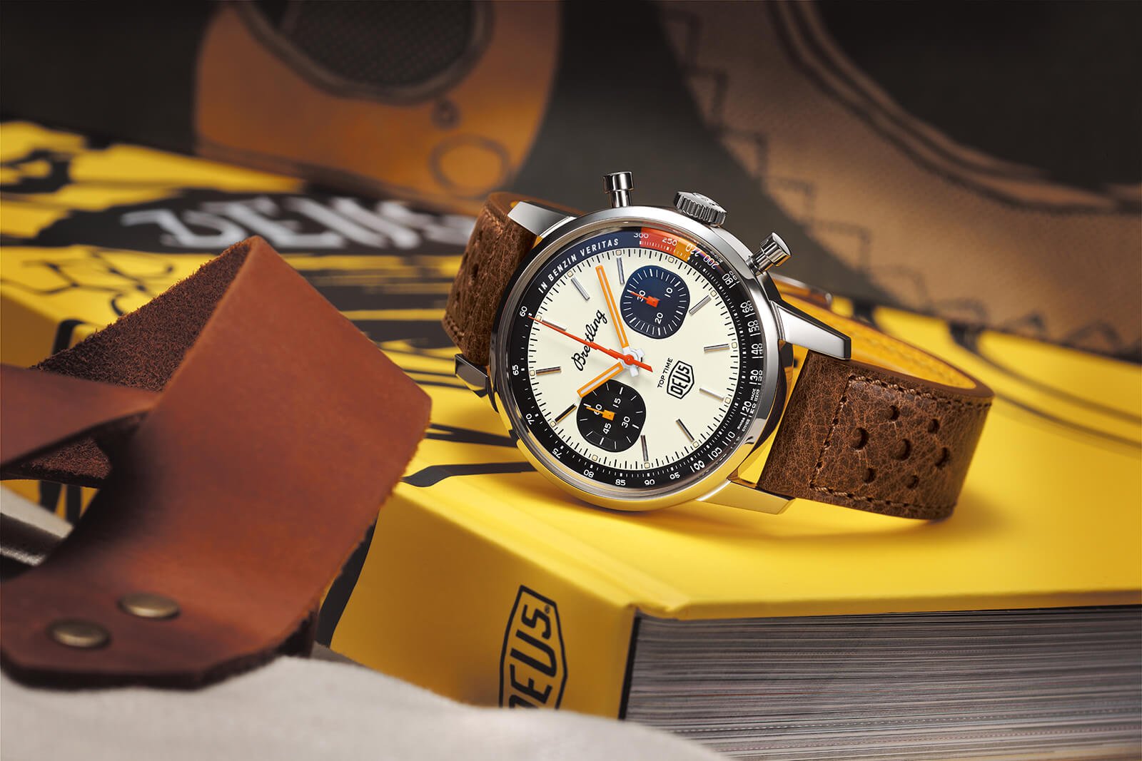 Breitling Top Time Deus Limited Edition deitado num livro amarelo