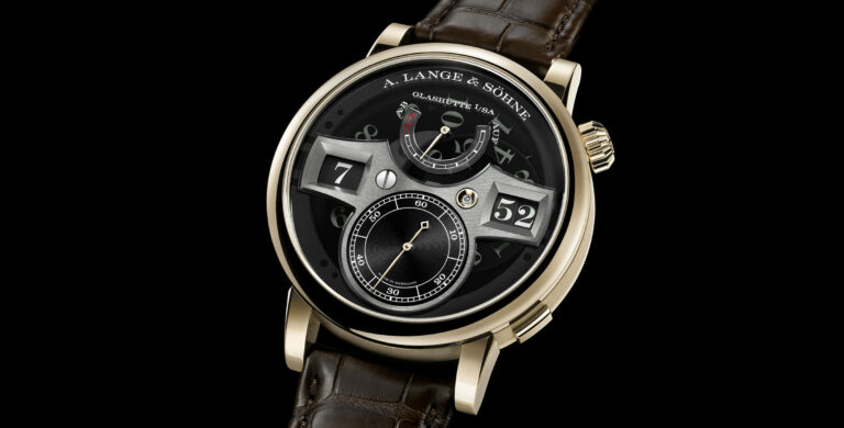 A. Lange & Söhne Zeitwerk Honeygold ‘Lumen’ em fundo escuro