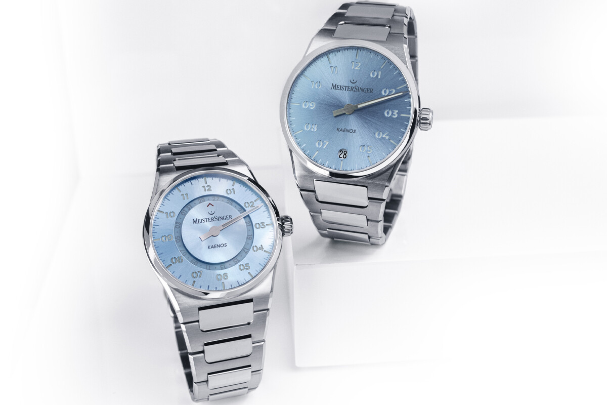 Relógios MeisterSinger Kaenos com mostrador de duas camadas e bracelete metálica integrada.