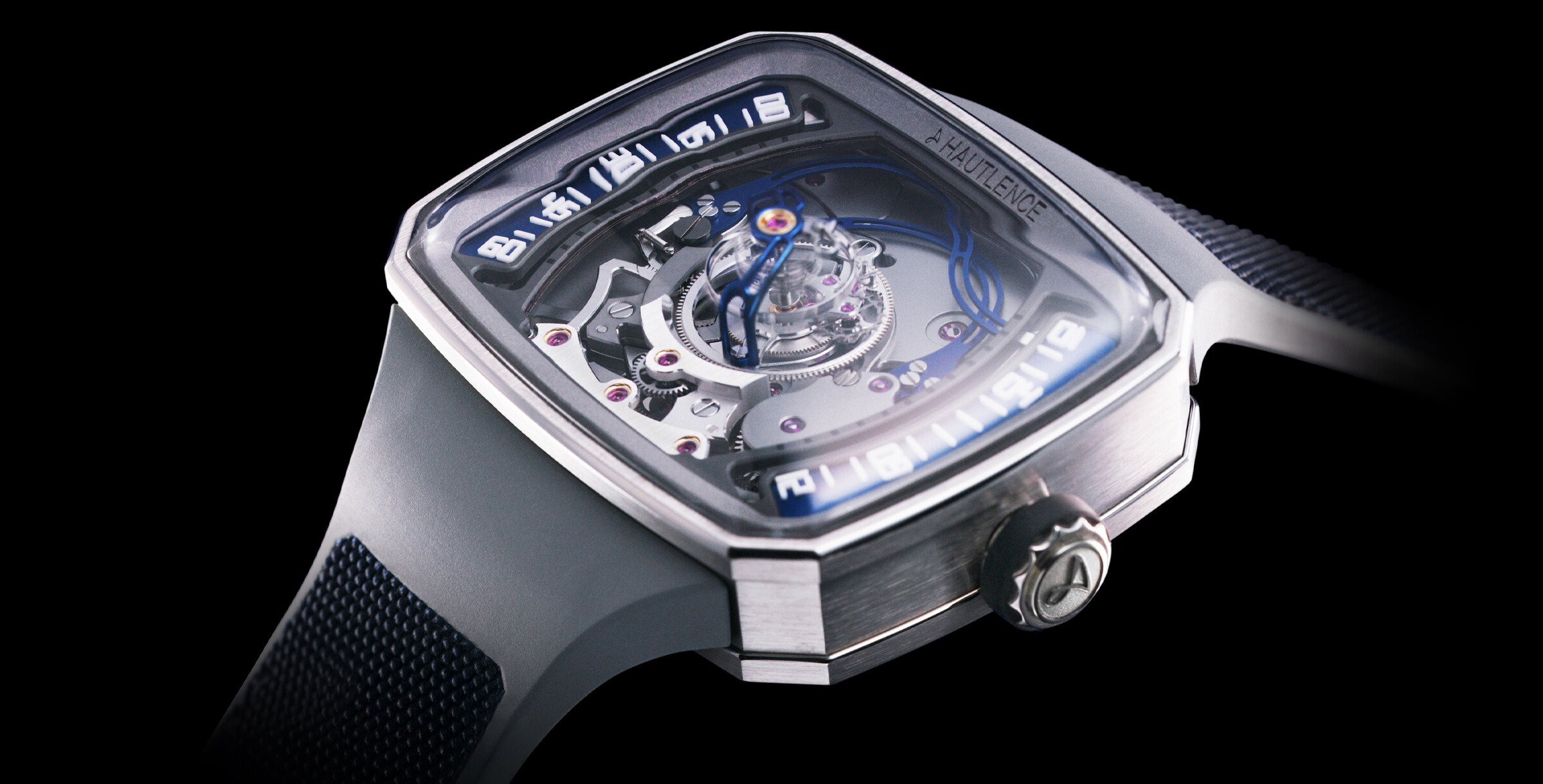 Relógio de luxo Hautlence Helix Series 1 com mostrador aberto, detalhes mecânicos visíveis e caixa retangular em aço escovado.