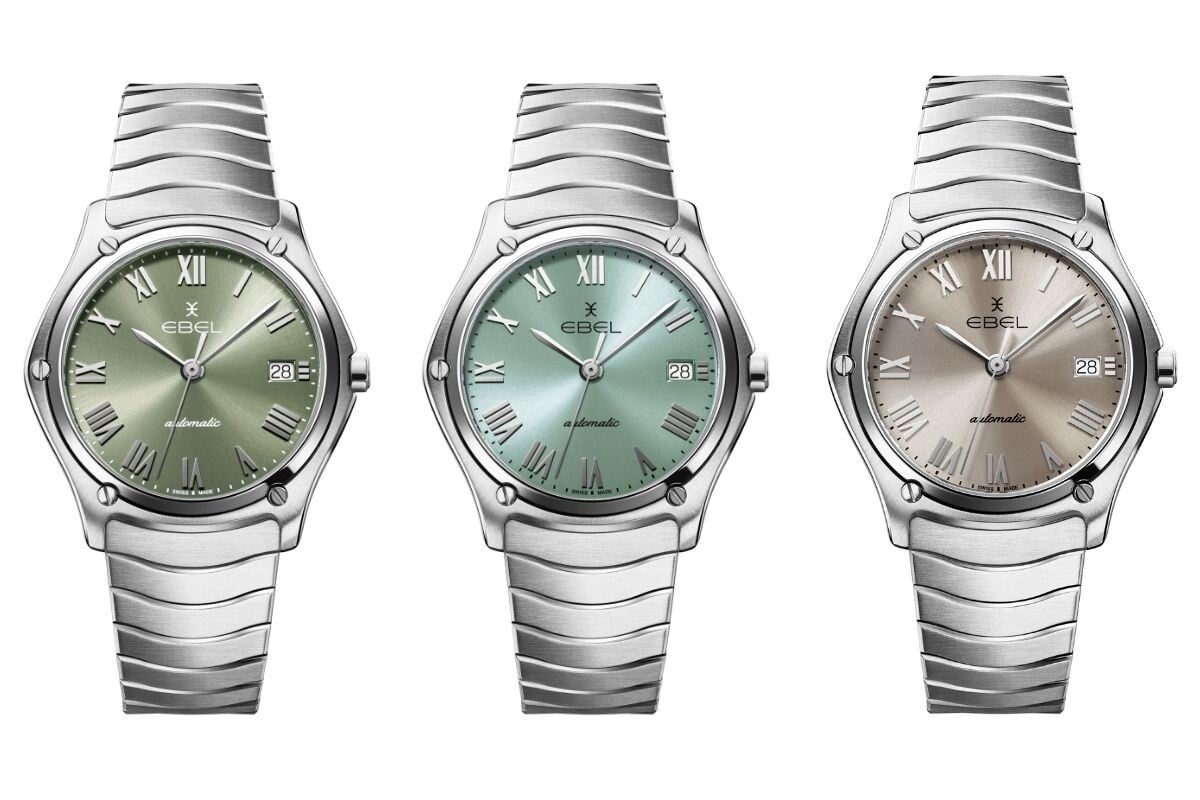 três relógios ebel classic vistos de frente com mostradores verde, azul e cinzento e bracelete metálica integrada na caixa