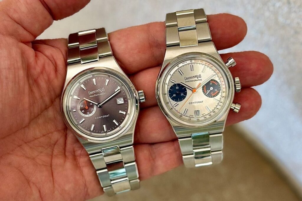 fotografia na mão dos modelos de relógio Contodat Automatic em cinza e Contodat Chronographe prateado da marca suíça de relojoaria Eberhard; foto: Miguel Seabra/Espiral do Tempo