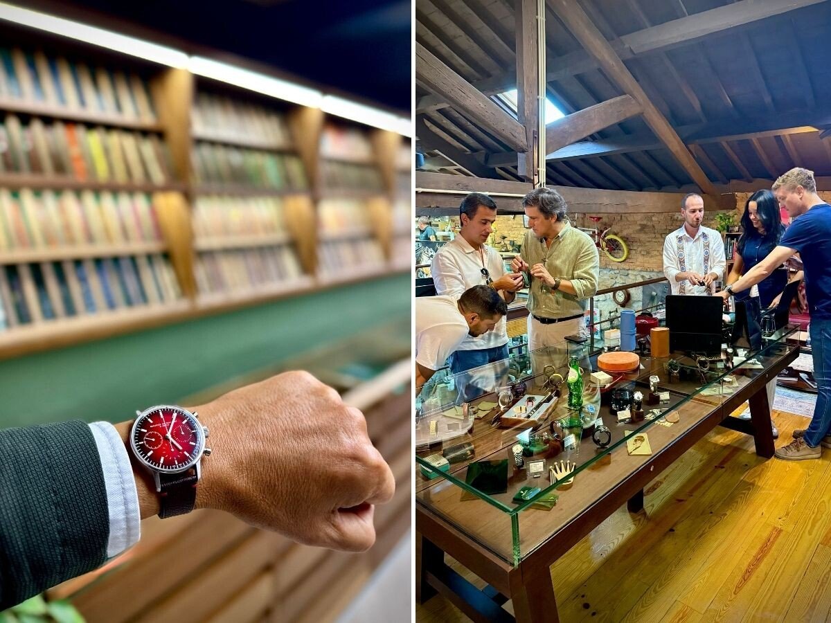 relógio de mostrador vermelho no pulso e pessoas a conversar numa sala com relógios na Watch Garage